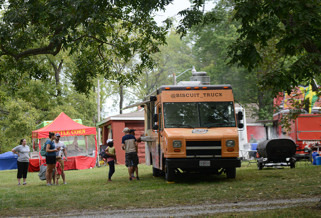 Festival-goers visit the Ozark Mountain Biscuit truck